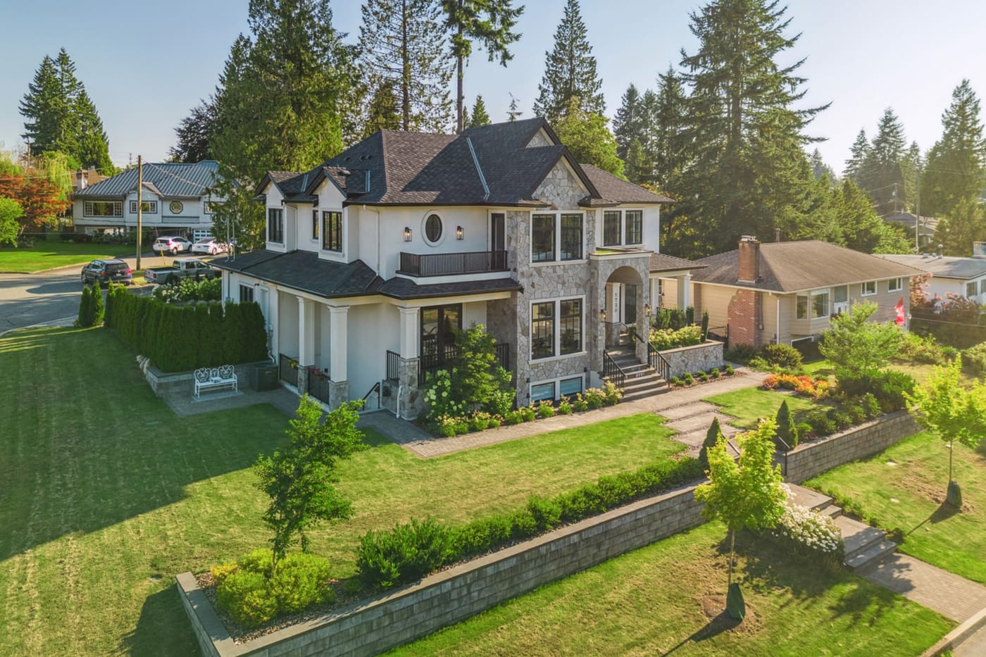 Aerial view of a custom home and landscaped yard